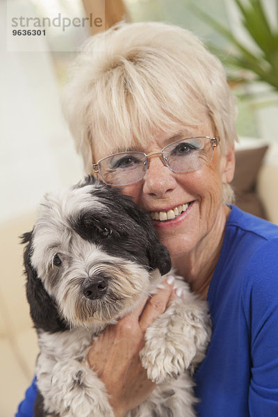 Senior woman loving her dog