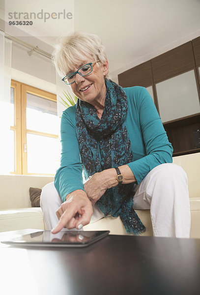 Senior woman using a digital tablet