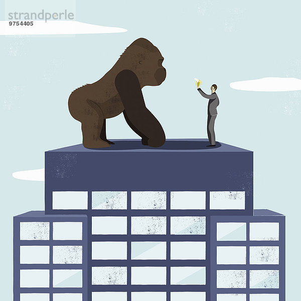 Geschäftsmann bietet einem Gorilla auf einem Hochhaus eine Banane an