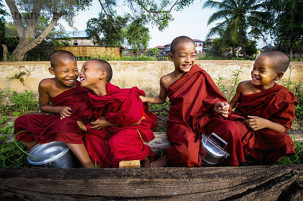 'Young monks laughing; Yangoon  Myanmar'