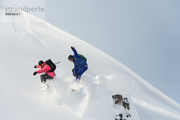 Snowboarding Pulverschnee Gesichtspuder Kanton Graubünden Schnee