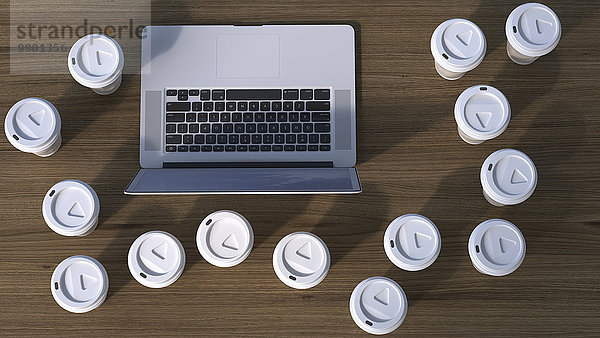 Laptop umgeben von Coffee to Go Pappbechern  3D Rendering