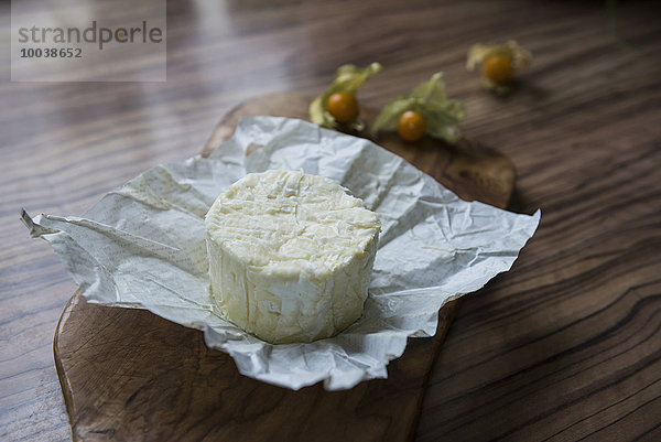 Close-up of white cheese on chopping board  Germany