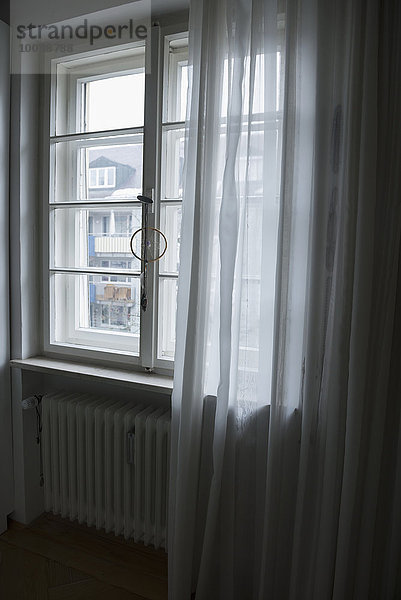 Curtain at window of a house  Bavaria  Germany