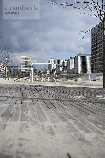 Playground surrounded by modern buildings in city  Munich  Bavaria  Germany