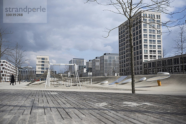 Playground surrounded by modern buildings in city  Munich  Bavaria  Germany