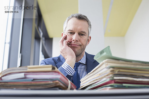 Businessman working in office  Leipzig  Saxony  Germany