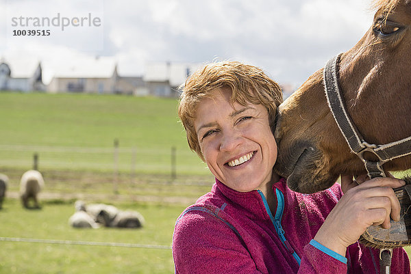 Close-up of woman with her dog in ranch  Bavaria  Germany