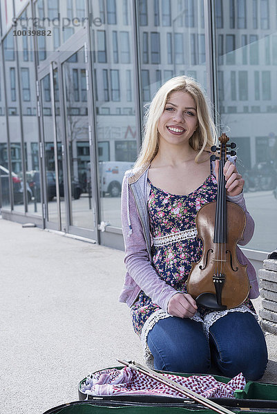 Caucasian teenage girl musician playing violin  Munich  Bavaria  Germany