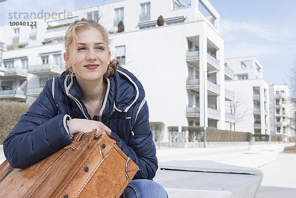 Young woman waiting with city in background  Munich  Bavaria  Germany