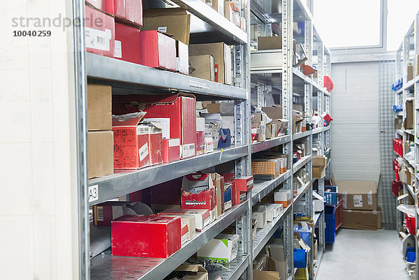Interiors of warehouse with goods on shelves  Munich  Bavaria  Germany