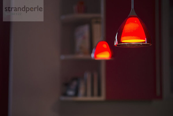 Illuminated pendant lights hanging with ceiling  Munich  Bavaria  Germany