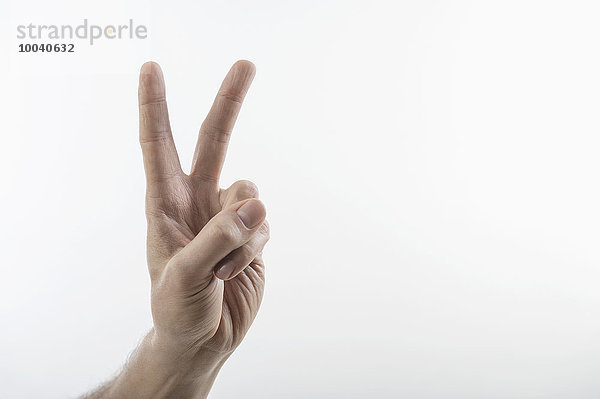 Male hand making peace sign  Bavaria  Germany