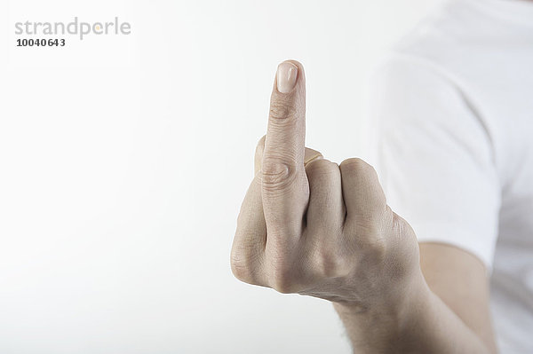 Close-Up Of a man's hand showing obscene gesture  Bavaria  Germany