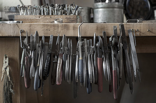 Various pliers hanging in workshop  Bavaria  Germany