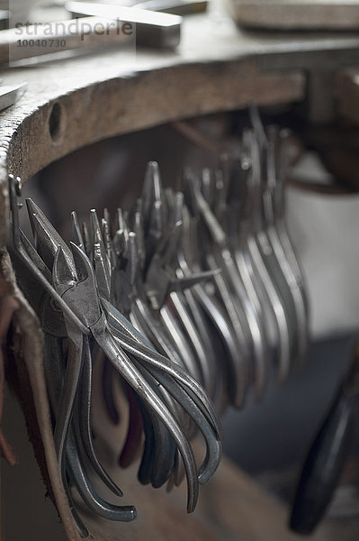 Various pliers hanging in workshop  Bavaria  Germany