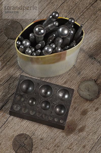 Close-up of dapping blocks and punches in workshop  Bavaria  Germany