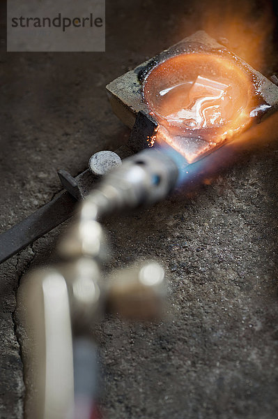 Melting copper in a jewelry shop  Bavaria  Germany