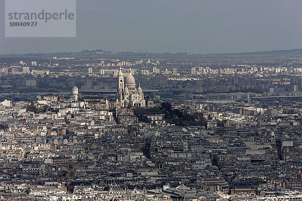 Crowded buildings with Montmartre in the distance  Sacre Coeur  Montmatre  Paris  France