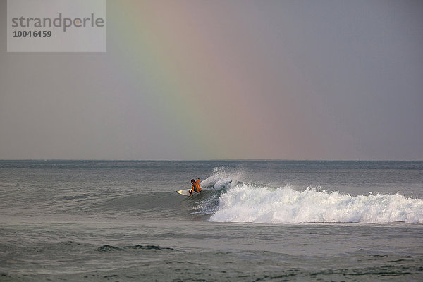 Indonesia  Bali  Surfing a wave