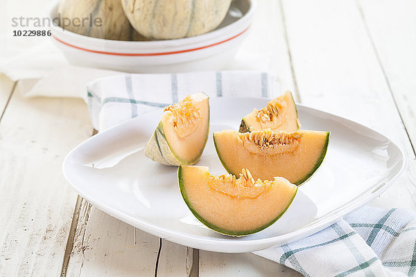 Teller mit geschnittener Charentais-Melone