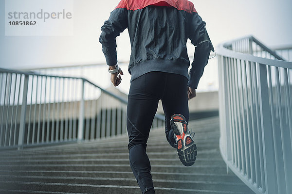 Low angle view of man running on steps