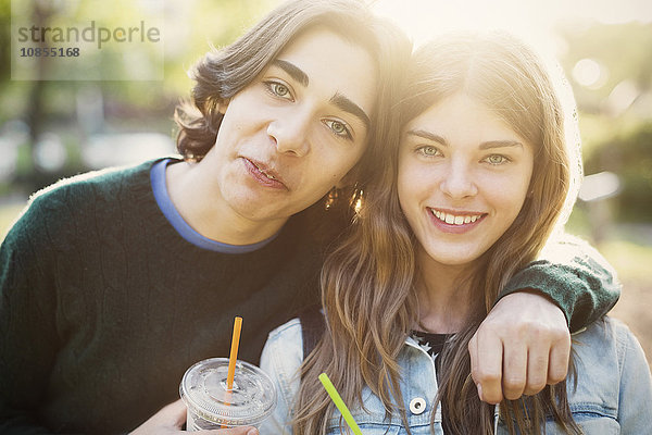 Portrait of happy teenagers at park