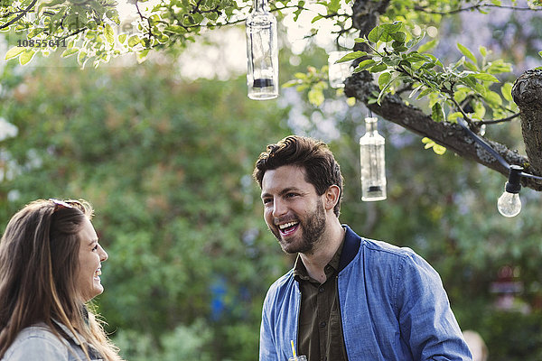 Happy couple enjoying at summer party