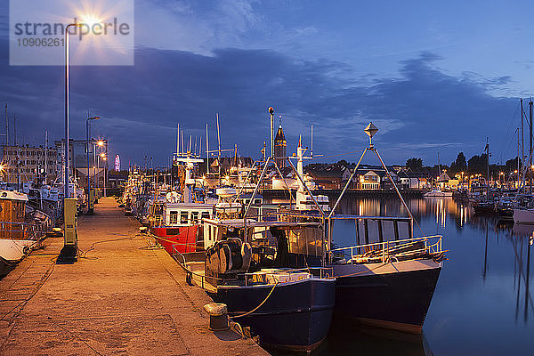Poland  Pomerania  Wladyslawowo town at night  fishing port with boats moored to a pier