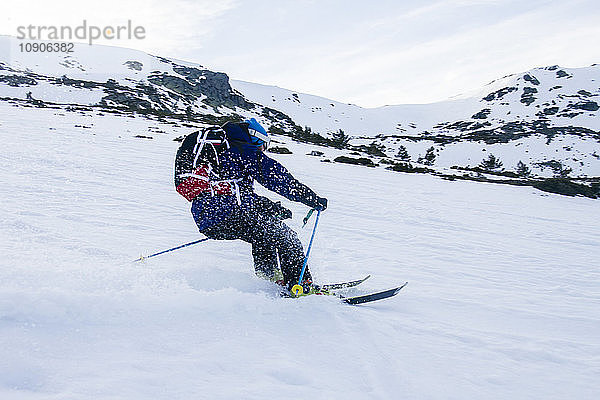 Man skiing in a snowy mountain landscape
