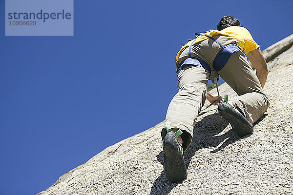 Man climbing in a granite wall