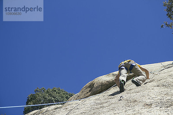 Man climbing in a granite wall