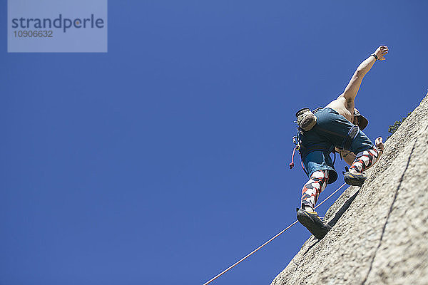 Man climbing without hands