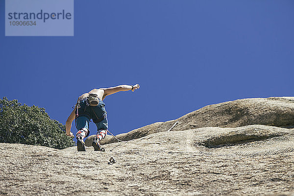 Man climbing without hands