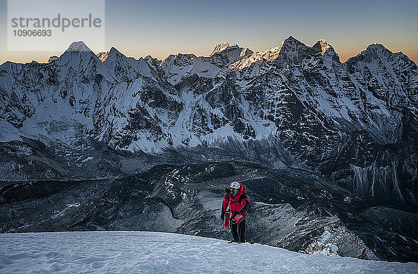 Nepal  Himalaya  Solo Khumbu  mountaineer at Ama Dablam South West Ridge at twilight
