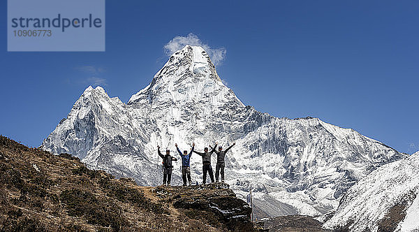 Nepal  Himalaya  Solo Khumbu  Ama Dablam  four Gurkhas in mountainscape cheering