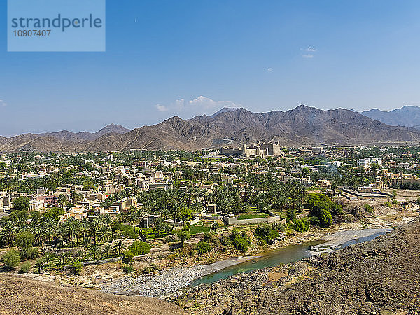 Oman  Dhakiliya  Oasis town Bahla  Fort Bahal in the background  Al Hajar al Gharbi Mountains