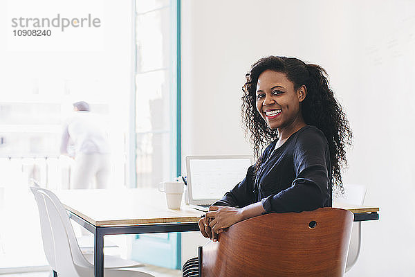 Young businesswoman in office  sitting at desk