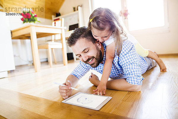 Vater und Tochter auf dem Boden liegend  Zeichnung auf digitalem Tablett