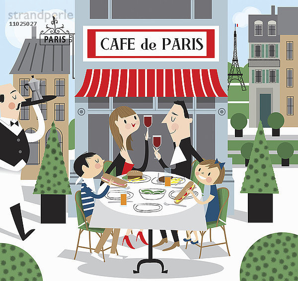 Familie isst zusammen in einem Straßenrestaurant in Paris  Frankreich