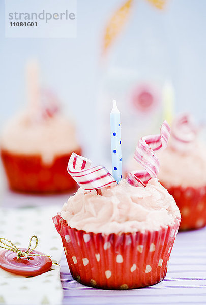 Cupcake mit Geburtstagskerze