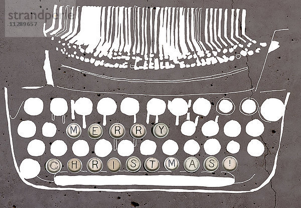 Frohe Weihnachten auf der Schreibmaschinentaste einer stilisierten Schreibmaschine