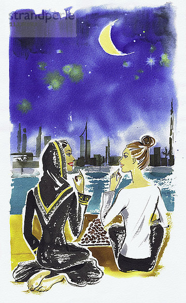 Freundinnen unterhalten sich am Wasser in Dubai und essen Datteln