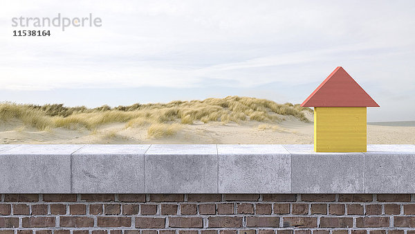 3D Rendering  Holzhaus auf Fensterbank  Strand im Hintergrund