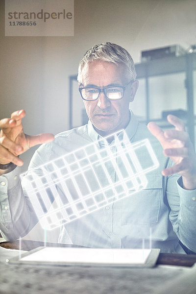 Männlicher Architekt mit Telekinese  schwebend  futuristisch glühendes Plastikmodell