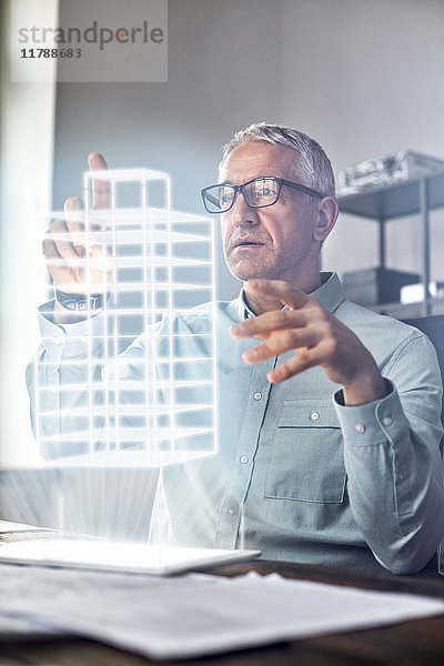 Männlicher Architekt mit Telekinese  schwebend  futuristisch glühendes Plastikmodell