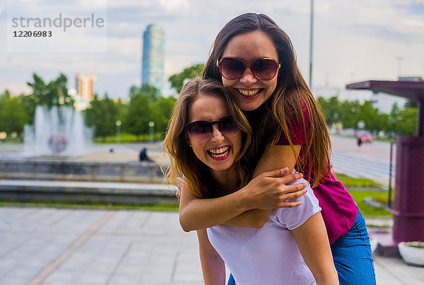 Portrait of smiling women hugging