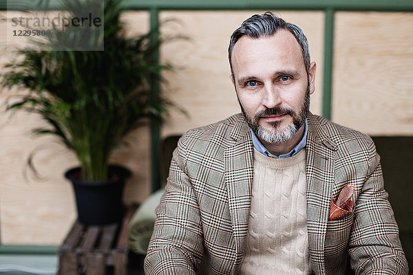 Portrait of mature businessman at office