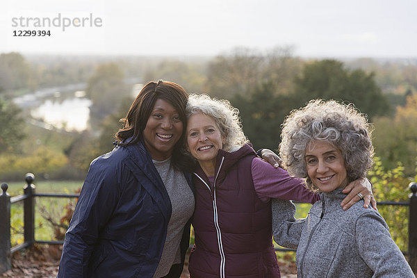 Portrait smiling  confident active senior women friends in autumn park