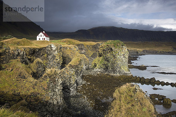 Remote house on craggy  remote cliff  Arnarstapi  Snaefellsnes  Iceland